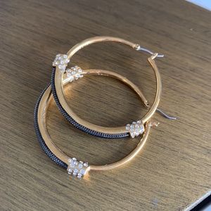 Sparkly 1 3/4 inch hoops in gold-tone with black metal & crystals.